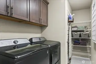 Generous upstairs laundry room.