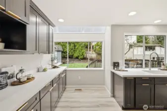 Sunlit breakfast nook with backyard views
