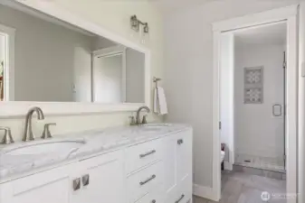 Main residence primary bath showing entrance to shower and toilet room.
