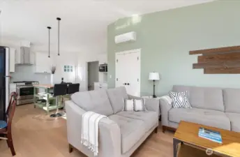 Guest Cottage looking from living area toward kitchen and bedroom, bath and laundry beyond.