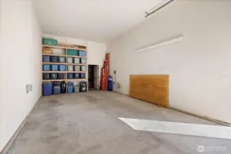 RV garage/shop interior showing the door to the separate storage area.