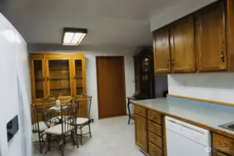 kitchen in bigger side, door to mudroom