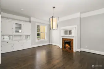 Dining Room with Built In Sideboard and Fireplace.