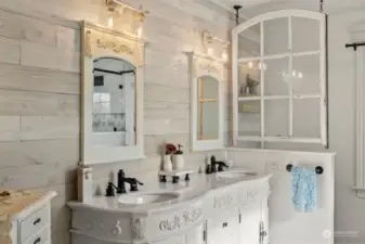 Farmhouse chic double vanity located off of the primary bedroom.