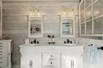 Front view of vanity, along with farmhouse accent double mirrors and shiplap walls.