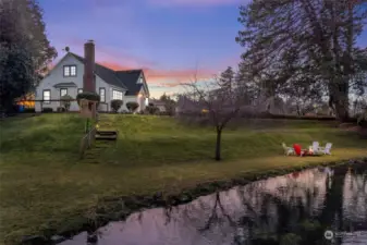 Side view of DeCoursey creek bank on property, and landscaping.