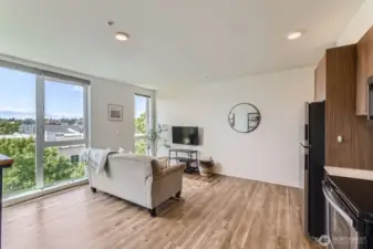 Living Room Lets in Ample Light with Large Floor to Ceiling Windows