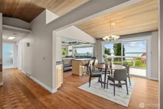 The dining room and kitchen come together in perfect harmony, with Puget Sound views stealing the show.