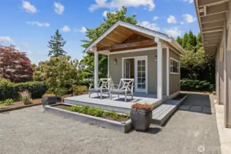 The charming studio is full of potential—perfect for a creative space or guest retreat, all while enjoying your backyard sanctuary.
