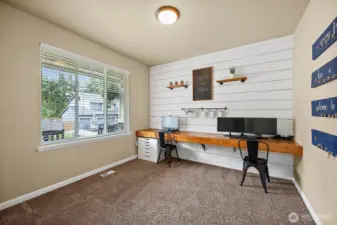 Upon entry, a very large office/den is on your left.