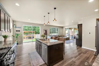 open concept living downstairs with two oversized, massive sliding doors