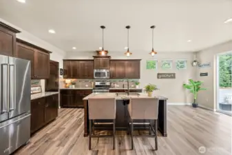 open concept living downstairs with two oversized, massive sliding doors