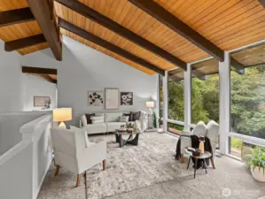 Floor to ceiling windows continue into the living room where you'll be able to look out at the 5th green.