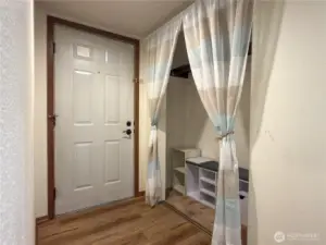 The entry has a large guest and coat closet (The original doors are in the storage room if you want to put them back up)