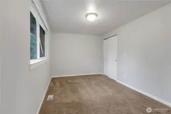 Primary Bedroom with a window facing the backyard.