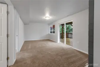 Downstairs Living Room with sliding door to lower deck and backyard.