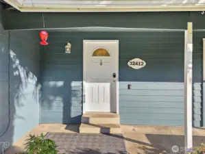 Very lovely covered front porch area.