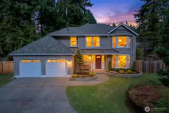 As evening sets in, the home takes on a warm, inviting presence, tucked into a peaceful, tree lined setting. It is the kind of curb appeal that immediately feels calm and established, a great fit for English Hill living.