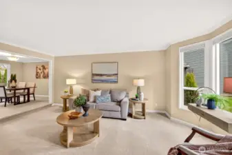 A spacious front living area offers a flexible place to unwind or host guests, with great natural light and clean lines. New carpet and crisp trim details give the room a fresh, move in ready feel.