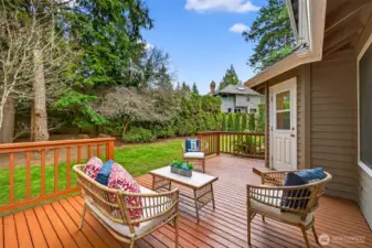 The backyard deck expands the living space and creates an easy indoor to outdoor connection. There is room for both dining and lounging zones without feeling cramped. The setting feels private and surrounded by Northwest greenery.