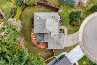 A true top down aerial view helps show the lot shape, deck placement, and how the home sits within the neighborhood. You can clearly see the outdoor living footprint and the separation from adjacent properties.