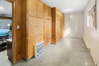 Generous size garage and a storage/work room at the back of the garage