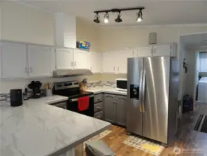Spacious kitchen with lots of cabinets.  New refrigerator w/water and icemaker