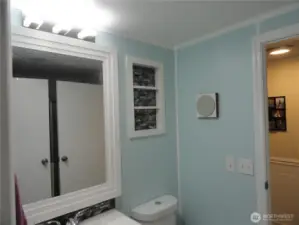 Main bathroom, access from either the utility room or the hallway. Shower are behind both doors!