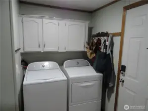 Utility room includes new washer and dryer