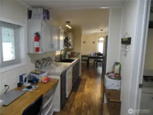 Between the kitchen and ulility room is a large workspace for your computer or whatever suites you!