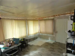 Inside the bonus room from the primary bedroom.  This is ready for sheetrock!  Use this as extra storage or bring your plants and let them soak up the abundance of sunshine!