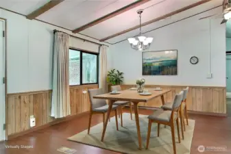 View of your dining room from the kitchen, you will see you actually have many options on where you can place your living room and dining furniture, open-concept due to the kitchen remodel and removal of a non load-baring wall in the past. ***Virtually Staged***