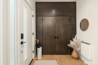 Entry with large closet and rich wood molding