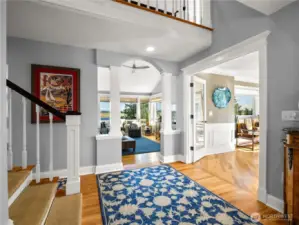 Wainscoting, architectural details such as arched doorways and decorative pillars are sprinkled through out this home.