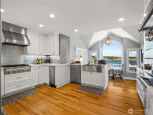Fully remodeled kitchen with stainless steel, hardwood floors is an inspiring place to cook.