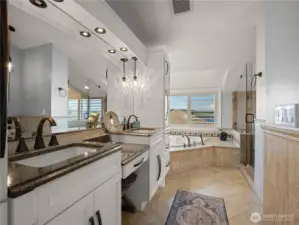 Primary bath with double sink, walkin shower and soaking jetted tub.