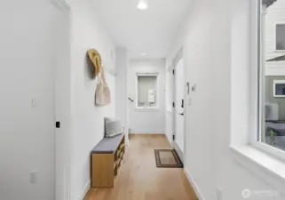 Engineered hardwood floors and a clean color palette are inviting.