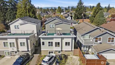 A view of the community from the alley. This unit offers one reserved parking.