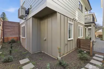 A view of the gate leading from the front entry of the home to the side yard.