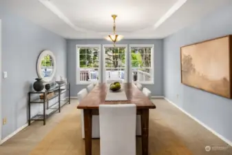 Dining Room features coved ceiling and serene view of back deck and yard.