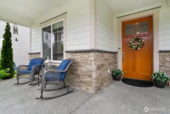 Front covered porch with oak door