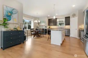 Kitchen with dining room and island and stainless steel appliances
