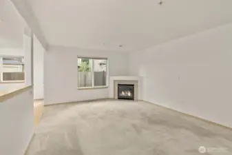 Gas fireplace accents the living room.