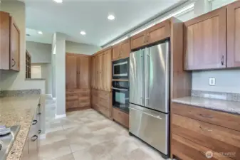 Kitchen view 2 towards entry, so much storage!