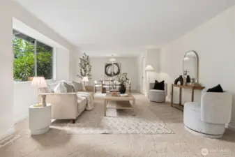 The formal living room offers a warm and inviting place to gather. Its generous size provides flexibility for different furniture layouts or conversation areas.