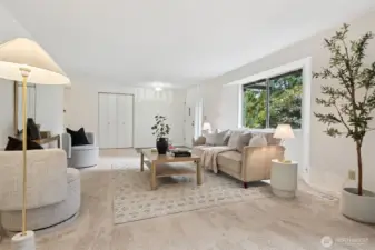 Natural light highlights the soft, new carpeting and fresh finishes, creating a welcoming first impression.