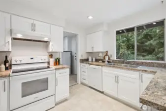 Lovely new kitchen with crisp, white shaker cabinetry and plenty of storage. The design combines timeless style with everyday functionality. Every detail was considered to make cooking and entertaining effortless.