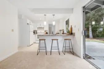 The kitchen eating bar is the perfect space for casual meals, conversation and serving area or workspace.