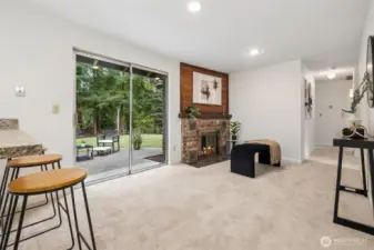 The slider from the family room, kitchen eating area opens out to the back patio and yard.