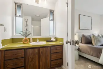 The Primary En Suite offers a walk in shower and large cabinetry with lots of room for your personal toiletries.